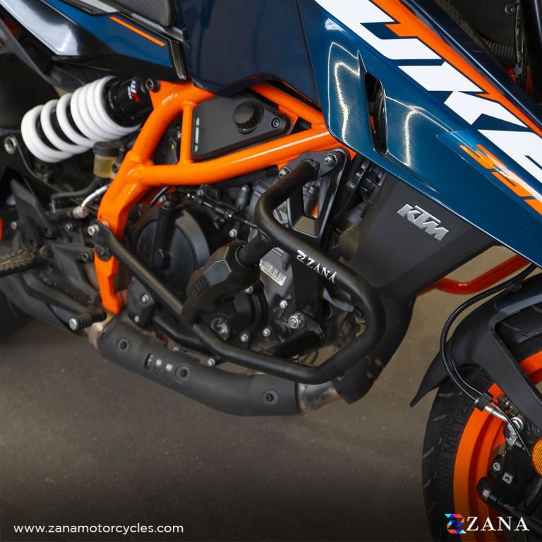 Crash guard with slider puck in black color for KTM