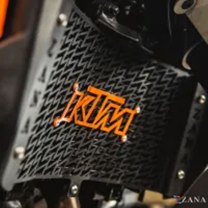 ZANA Radiator Guard with KTM Logo Orange For KTM Adv 390 2025 (Black SS 304 )-ZI-8583