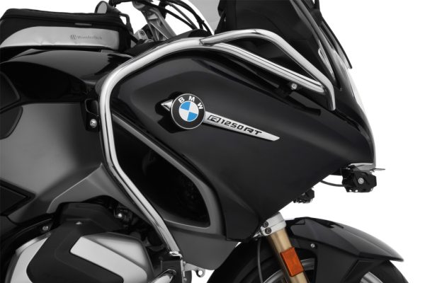 Wunderlich BMW RT Series Protection - Tank Guard (Chrome)-44140-203 Fitment and compatibility Black BMW BMW R1200 RT LC (2014-2018) BMW R1250RT (2019 - 2020) This tank protection bar not only reliably protects the tank but the faring of the stem and the highly at risk radiator units. Together with the engine protection bar, it forms a sophisticated all-round protection concept for passive safety: In the event of a crash or fall, the effective forces are optimally distributed across the structure of the protection bar and the durable attachment points, thus avoiding high forces. The protection bar integrates very well into the design of the bike on a visual level and highlights the striking look. The tank protection bar is made from a composite of 25 mm and 18 mm precision stainless steel tubing. These consist of tube segments that are shaped on CNC pipe bending machines specifically for each model and then clean welded. The protective function and product design are the central focus with our protection bars. We therefore off the protection bar in black. The steel surface is powder-coated. This means the clever protection integrates into the design of your BMW. The facts: Function Sophisticated all-round protection concept for passive safety Protective function and integrated product design Perfect, model-specific fit Fits only with Wunderlich engine protection bars Protection of the radiator/ventilators, tank side panel, the stem Equal distribution of effective forces Technical info Material: Steel Pipe diameter: 18-25 millimetres Detailed, easy-to-understand fitting instructions